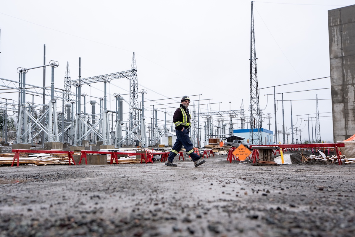 A worker walks in the BC Hydro Skeena Substation while under construction in Terrace, B.C., on Thursday, November 13, 2025. THE CANADIAN PRESS/Ethan Cairns