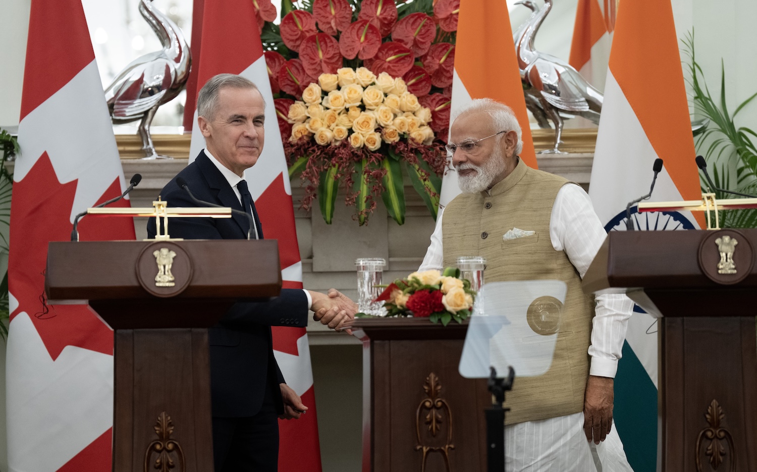 Prime Minister Mark Carney and Indian Prime Minister Narendra Modi shake hands following the presentation of agreements and joint statements in New Delhi, India, Monday, March 2, 2026. THE CANADIAN PRESS/Adrian Wyld