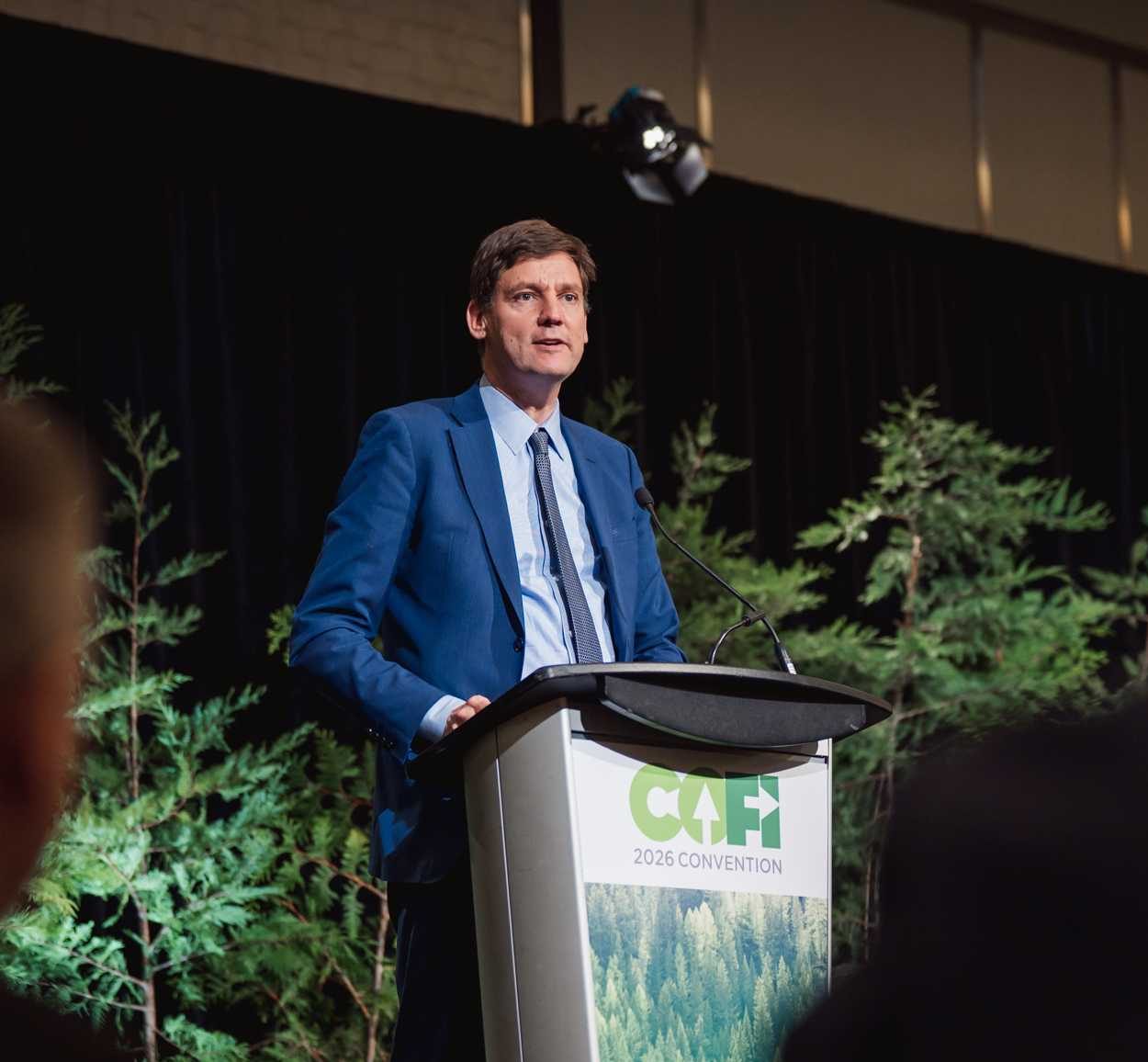 Premier David Eby delivering his luncheon keynote at the 2026 COFI Convention.