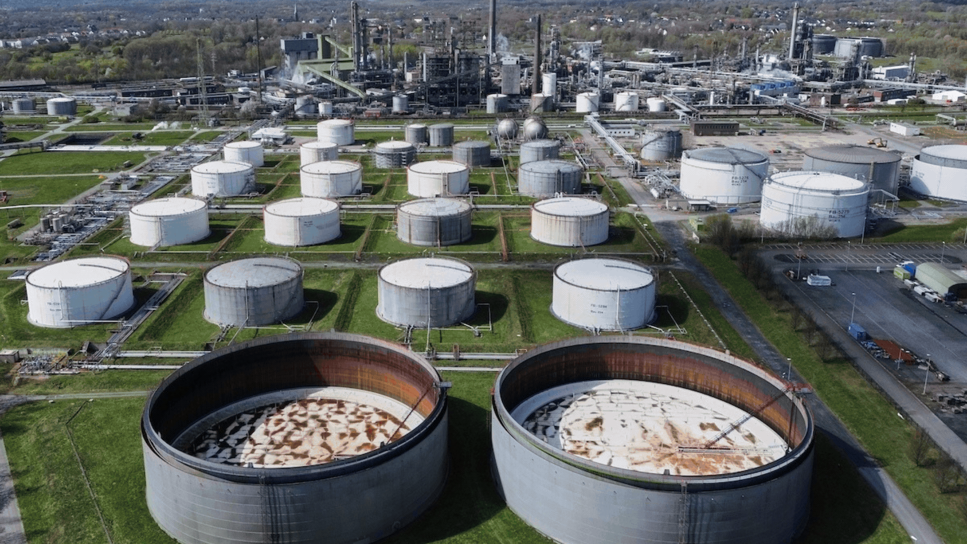 1. Empty oil tanks are seen at a big BP refinery in Gelsenkirchen, Germany, Wednesday, April 1, 2026. (AP Photo/Martin Meissner); 2. Gas prices are displayed at a Chevron gas station, in downtown Los Angeles, Tuesday, March 31, 2026. (AP Photo/Jae C. Hong); 3. A local vendor sells plastic containers loaded with diesel in Phnom Penh, Cambodia, Monday, March 30, 2026. (AP Photo/Heng Sinith)