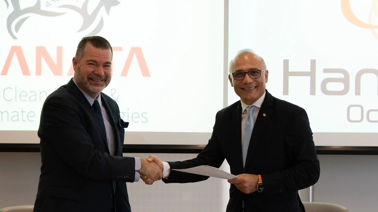 Robert Delamar, left, and Philippe Levy, Hunwha Ocean, sign MOU. | Kanata Clean