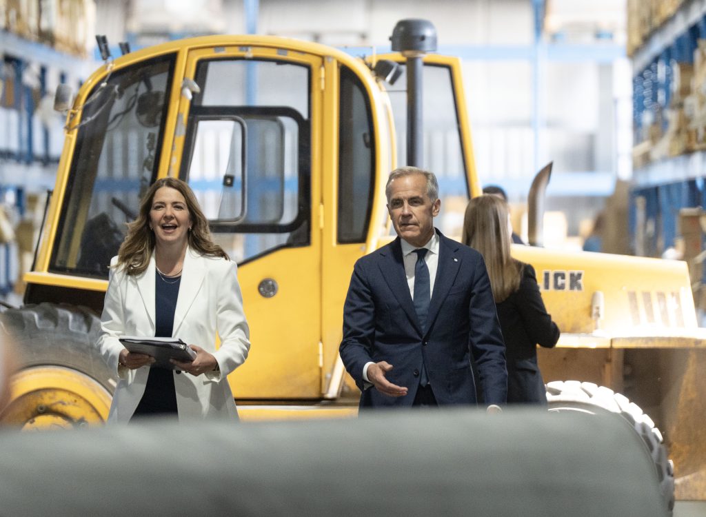 Prime Minister Mark Carney and Alberta Premier Danielle Smith arrive to announce a proposed pipeline from Alberta to the B.C. coast in Calgary on Thursday, July 02, 2026. THE CANADIAN PRESS/Todd Korol