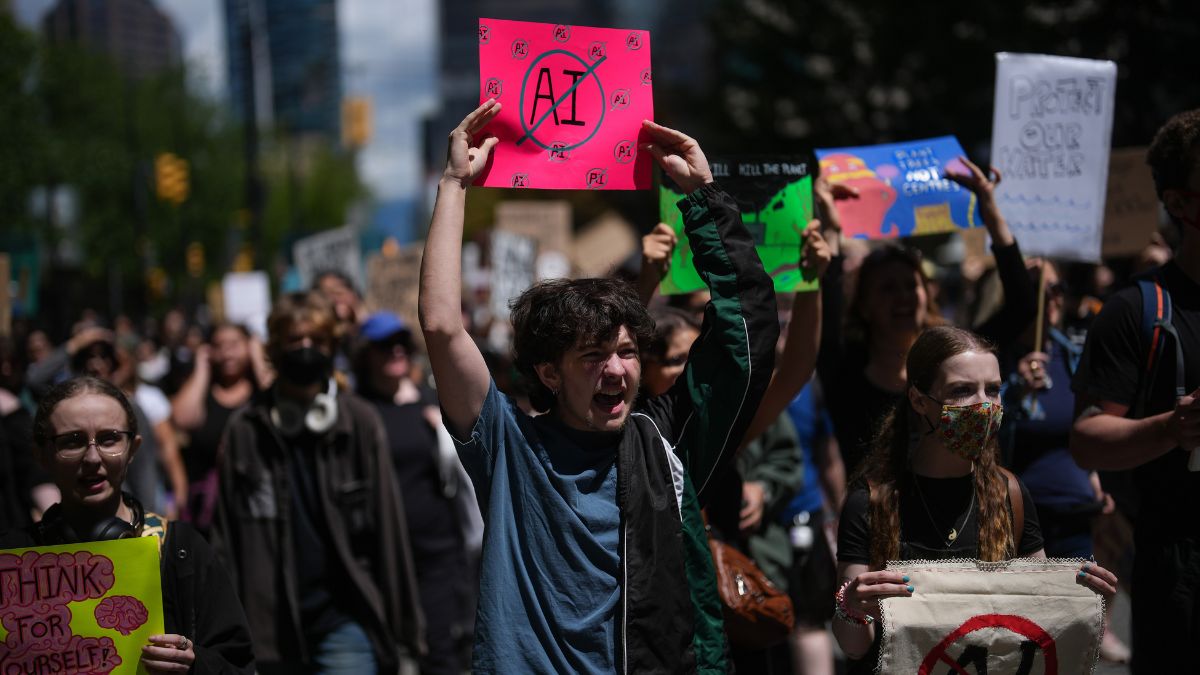 People participate in a march in Vancouver to protest the opening of AI data centres on Saturday, June 27, 2026. THE CANADIAN PRESS/Darryl Dyck