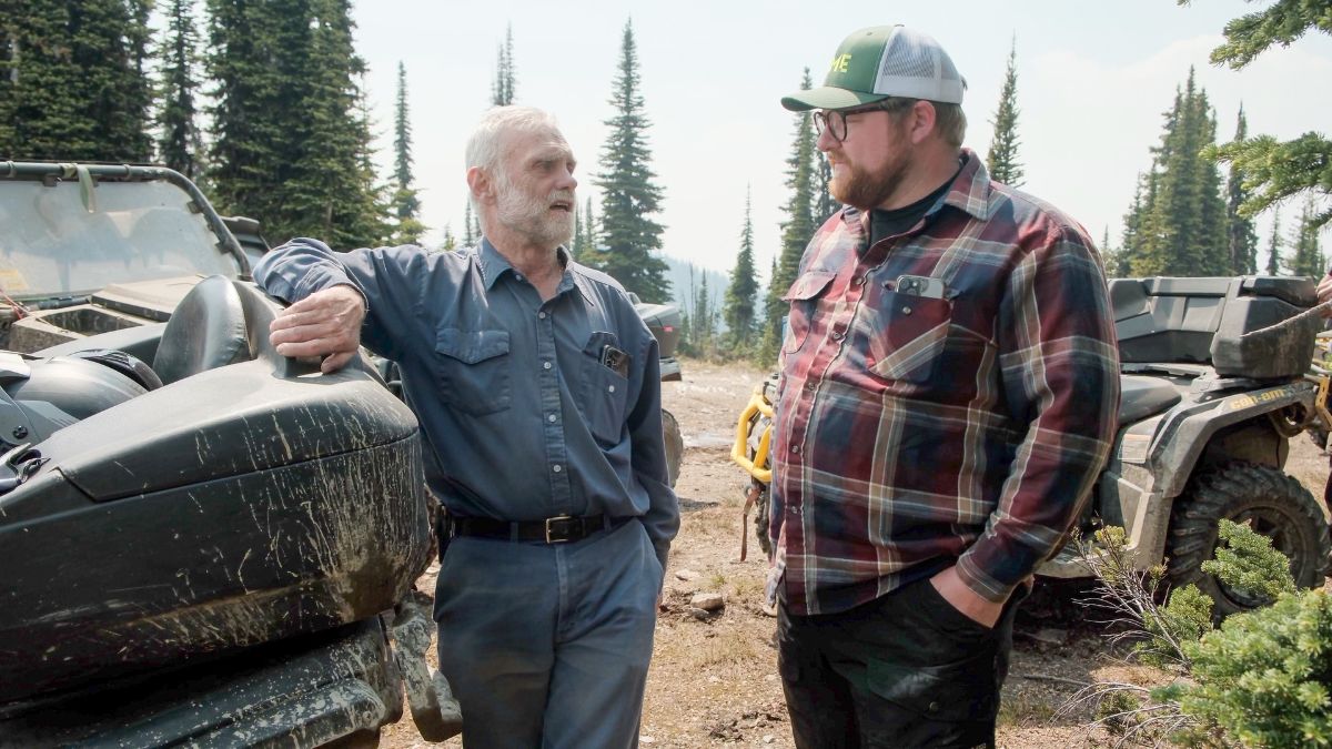 Jack Middleton of AME speaking with prospector Jack Denny, left, about the closure of forest service road. | AME screengrab