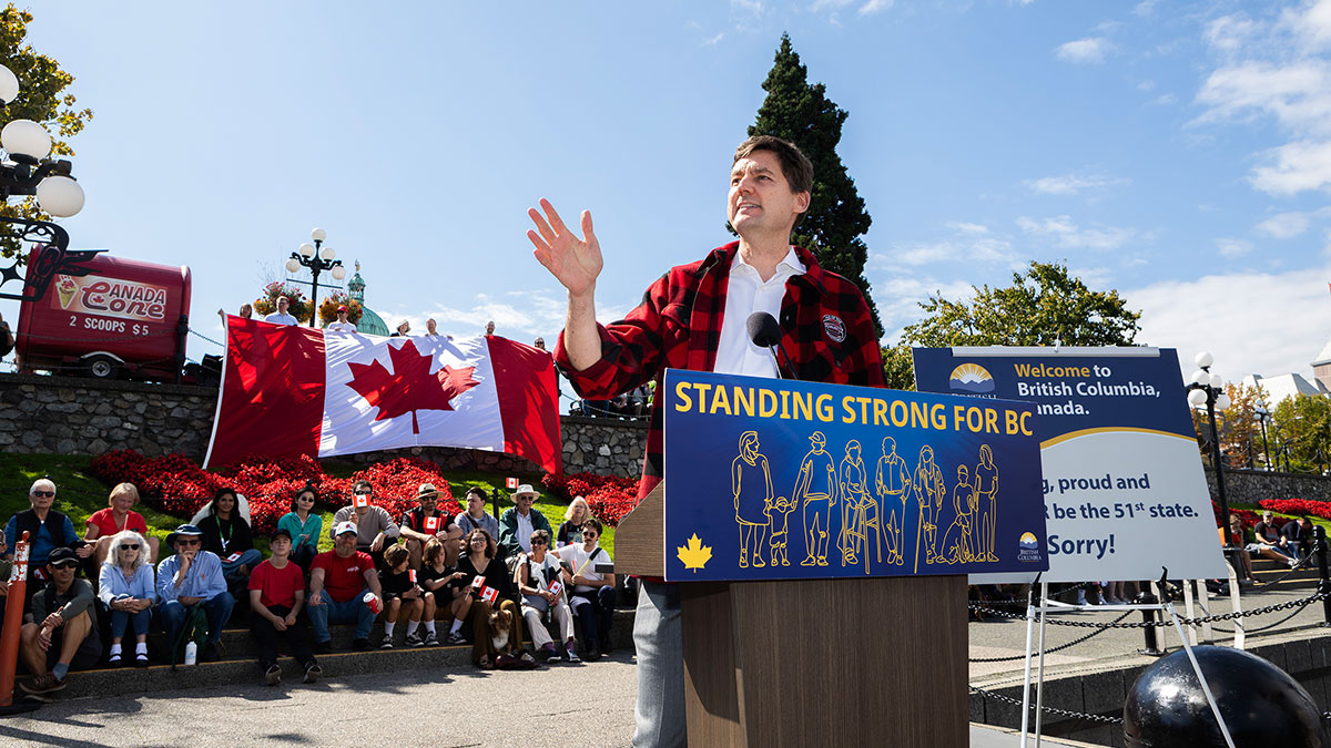 Premier David Eby is joined by fellow British Columbians for an event about showing support for Canada in the face of U.S. tariffs during a news conference at the inner harbour in Victoria., on Tuesday, Sept. 8, 2026. THE CANADIAN PRESS/Chad Hipolito